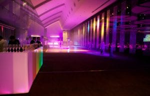 beaded curtains hanging from ceiling to create a wall with light up dance floor and light up illuminated furniture