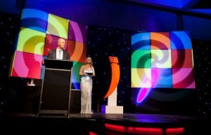 large hanging rubix cubes over stage at Crown perth. Colourful stage lighting