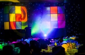 large hanging rubix cubes over stage at Crown perth. Colourful stage lighting