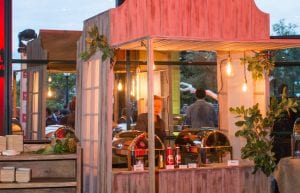 australian outback hut for food service with hanging edison globes