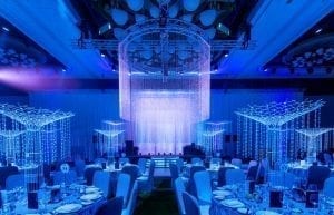 Winter Wonderland event theme with beaded chandelier, beaded curtains, crystal tree centrepieces, light up led staircase and chair covers for hire. Photo taken at Crown Towers Perth for Christmas Party.