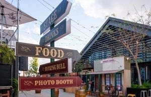 Wild West modern event styling theme with food hut furniture, native florals, chair, horse saddle, sheriffs office, event signage prop for hire. Photo taken at Camfield Perth for Christmas Party.