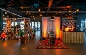Wild West modern event styling theme with themed props, food station, apothecary, Arabian rug, wine barrel, cactus, hi bar tables and stools for hire. Photo taken at Camfield Perth for Christmas Party.