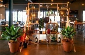 Wild West modern event styling theme with themed props, food station, apothecary, Arabian rug, wine barrel, cactus, hurricane lanterns, hi bar tables and stools for hire. Photo taken at Camfield Perth forcorporate conference