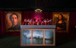 Rocky Horror event theme with red drapes, large gold frames, crystal candelabra centrepiece, led bar for hire.