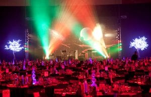 Space event theme with black drapes, giant inflatable stars, curved trussing entry feature, illuminated led hi bar furniture, lycra hi bar covers, coloured ghost stools, tiered orb centrepieces and wicker ball lights for hire.