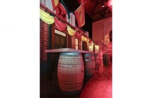 Spanish event theme with, drapes, bunting, wine barrels and Spanish styling props for hire.