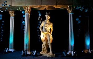 Under The Sea event theme with column temple set, fish, King Neptune statue, bubbles and wireless parcan lights for hire.