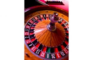 Las Vegas event styling theme with playing cards, casino tables and star cloth backdrop for hire. Photo taken in Perth for Christmas Party.