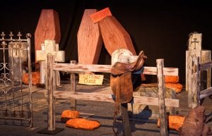 Wild West event styling theme with entry feature, horse saddles, hay barrels, cemetery, rocks for hire.