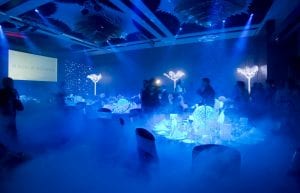 Winter Wonderland event theme with led light up trees, star cloth backdrop, wicker ball centrepieces, and mirror centrepiece bases for hire.