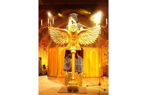harry potter event theme with gold owl lectern, candelabras and candle centrepiece props for hire